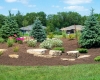 Forever Green Coralville Iowa Landscaping berm plantings outcropping limestone
