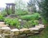 Forever Green Coralville Iowa Landscaping planting beds perennial garden pathway limestone wall