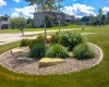 Forever Green Coralville Iowa Landscaping plantings outcropping round beds