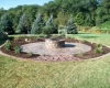 Forever Green Grows Coralville Iowa Fire Pits stone backyard plants