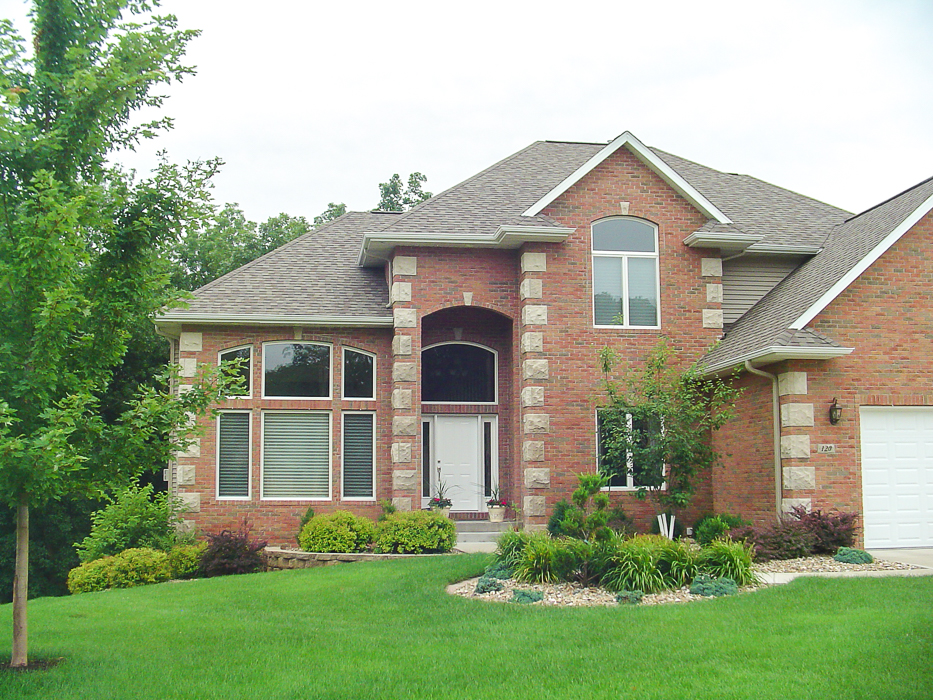 Forever Green Coralville Iowa Landscaping brick house front yard