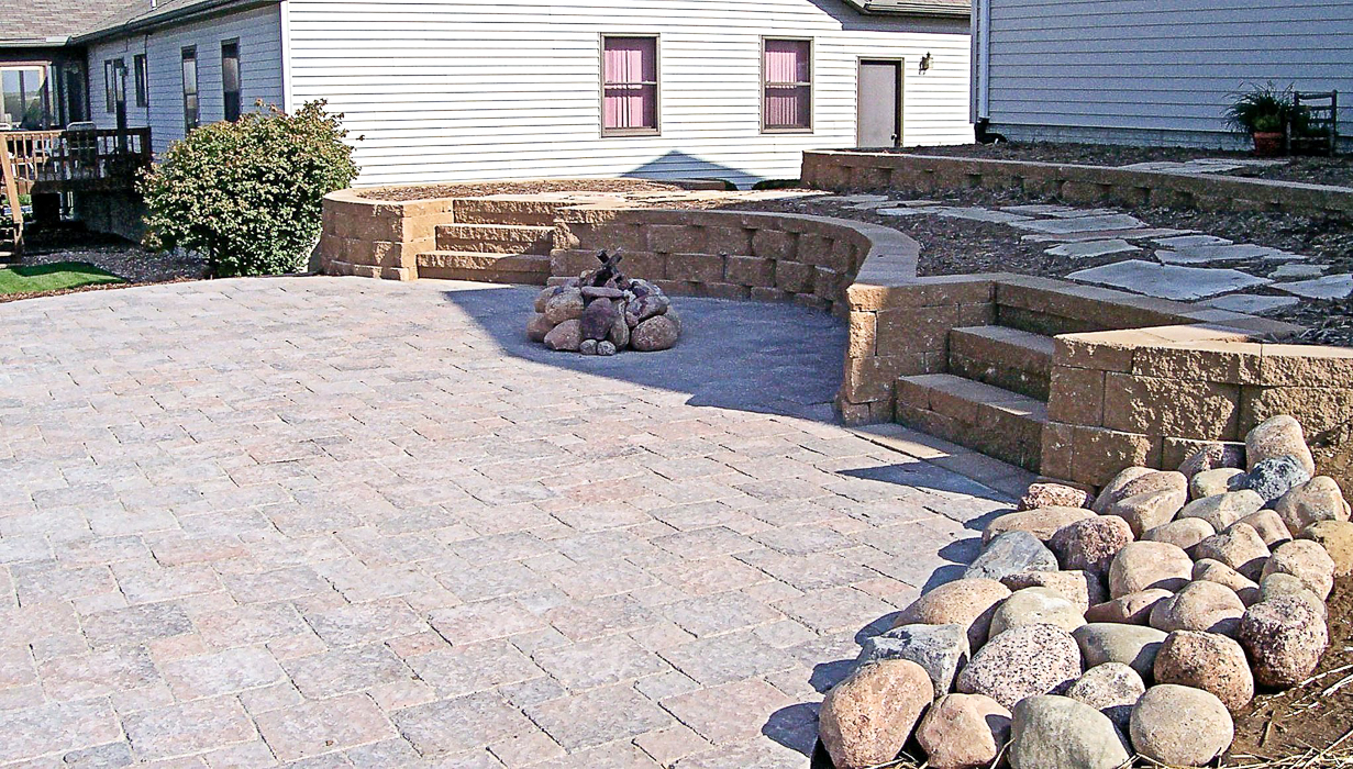 Forever Green Grows Coralville Iowa Fire Pits boulder wall retaining wall patio pathway